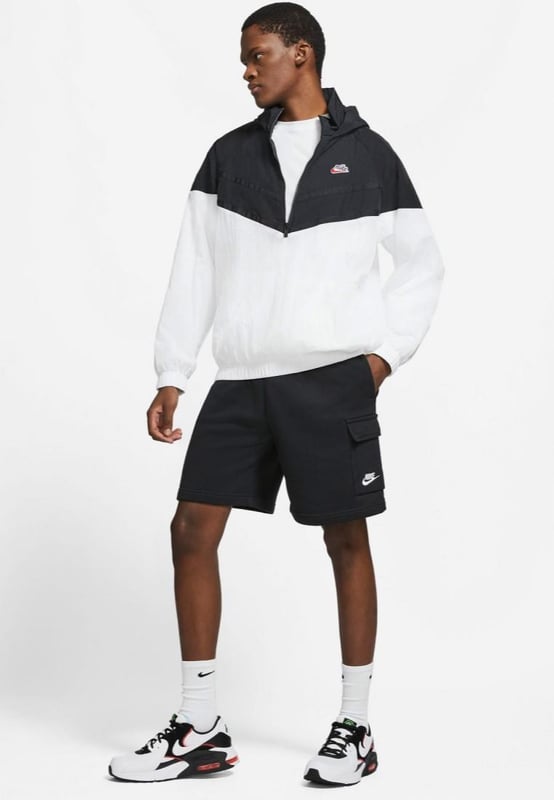 Nike Club Mens Cargo Shorts in Black The Nike Sportswear Club Fleece Shorts are made with a soft, brushed-back fleece that provides a comfortable feel ready for everyday wear . - - . Elastic waistband with an adjustable drawcord lets you personalize the fit . - - . A flap pocket on the left leg provides additional storage for your phone and other small essentials . - - . Brushed-back fleece fabric feels soft and smooth . - - . Standard fit for a relaxed, easy feel.