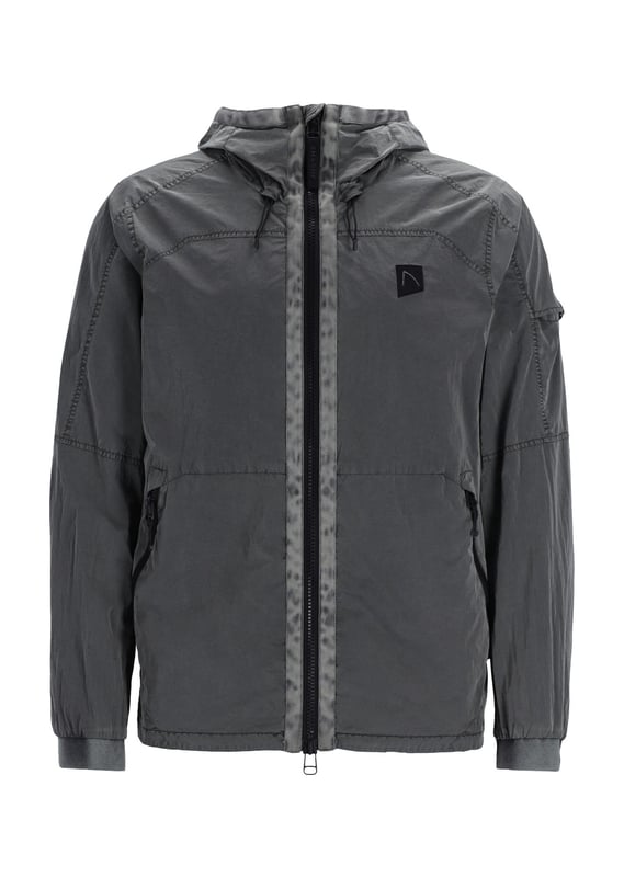 The Ortega is a regular fit summer jacket made from garment dyed polyamide for a unique color. It features a 2-way zip with tonal webbing tape, 2 side pockets, and an interior pocket with a zipper. Signature details include the CHASIN' comma badge and branded cord stoppers. The lining is made from polyester mesh.