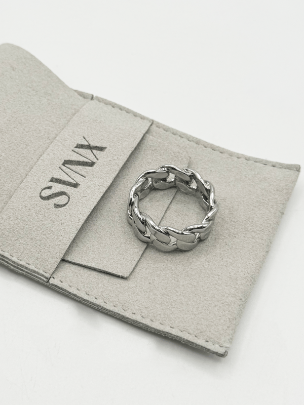 The ring's polished finish enhances its sophisticated appeal, making it a versatile accessory suitable for any occasion. Whether worn as a statement piece or a subtle nod to one's heritage, this Cuban silver ring embodies timeless style and cultural pride.  Ring Size 9. Stainless Steel.