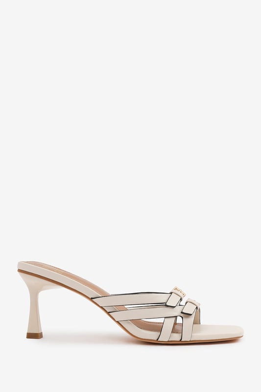 Step up your style with these Torigh Cross Over Buckle Details Strap Heel. Perfect for casual outings or dressy events, these sandals combine modern elegance with lasting comfort, making them a must-have addition to your wardrobe.

Key Features: 
Durable Construction: Crafted with high-quality faux leather, these sandals are designed to last. The sturdy heel and durable straps provide reliable support, ensuring they can withstand regular wear without compromising style.
Chic Design: The multi-strap design with subtle metallic accents exudes elegance and sophistication. The square toe and slender heel add a modern, fashion-forward touch that enhances their timeless appeal.
Comfortable Fit: Featuring a padded insole and a balanced heel height, these sandals provide all-day comfort without sacrificing style. The open design ensures breathability and ease of wear, making them perfect for any occasion.

Specifications:
o   Material: High-quality faux leather
o   Heel Type: Slender heel
o   Closure: Slip-on design for convenience

Elevate your footwear collection with these Torigh Cross Over Buckle Details Strap Heel. Combining chic design, durable construction, and superior comfort, they are perfect for making a statement wherever you go!