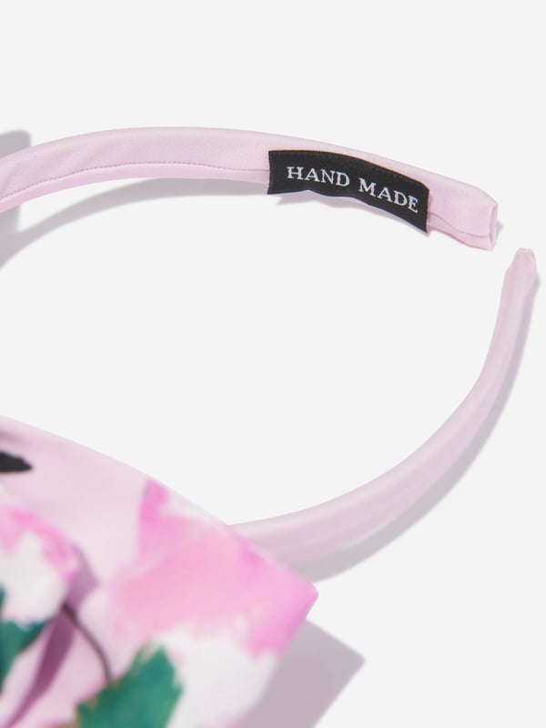 Mama Luma incorporate beautiful eco-friendly materials into their sophisticated handmade aesthetics. This girls pink headband is reflective of the Californian label's precision of beauty. Crafted in a top bow with floral patterning for a sweet finish. She will be obsessed. ‚ Handmade‚ Floral Patterning‚ Polyester‚ Bow‚ One Size