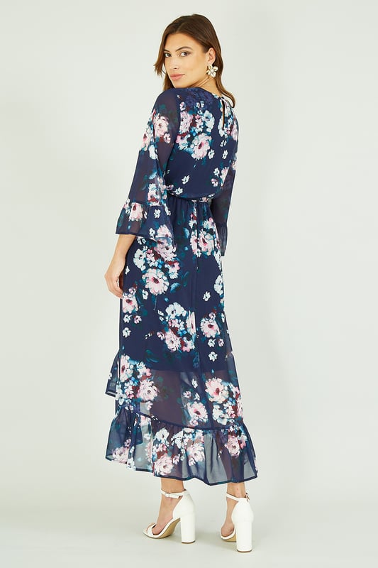 Featuring 3/4 cuffed sleeves, a flattering waist tie belt and a super cute dipped hem, this Yumi Navy Watercolour Floral Print Dress will inject a little pzaz into your closet. Wear for special occasions - just pair with strappy heels.