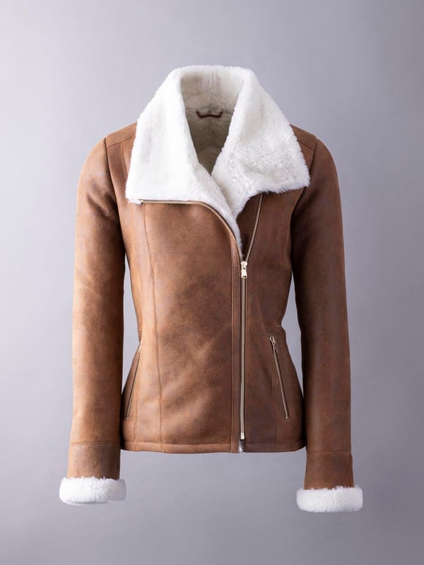 Allerdale Sheepskin Aviator Jacket in Caramel For those wanting to add a little extra glamour to their sheepskin aviator, the Allerdale offers just that. We've taken the classic style, in a rich-caramel hue, and added gold-toned hardware, to elevate the Allerdale. Hand-crafted from 100% sheepskin, this aviator has a nappalan finish, and in time it will develop a crackled vintage effect. Combined with a contrasting white wool, showcased on turn-back cuffs and a chunky collar, this is a distinctive jacket. The styling is incredible, yet nothing should take away from the sheepskin. After all these years it remains our favourite material, offering the perfect balance between form and function. As nature's ultimate insulator it's the first jacket you'll turn to when the temperatures drop. And, it will be with you for years to come.