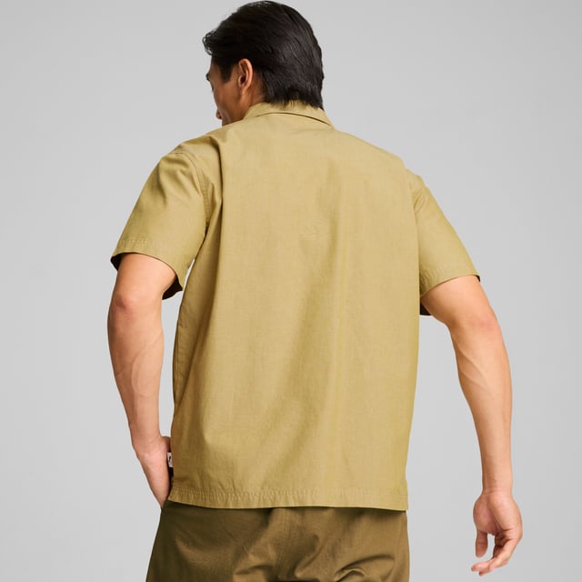 PRODUCT STORY: MMQ = "Macht's mit Qualität." Translated from German, it means "Made with Quality" and represents the finest in PUMA's designs and materials. Minimalistic aesthetics, contemporary silhouettes, with a passion for sophisticated details. This shirt has a relaxed fit and a half-zip closure. FEATURES & BENEFITS: Made with at least 20% recycled cotton. DETAILS: Relaxed fit; 210 gsm, plain weave; Collar; Short sleeves; Half-zip closure with metal zip pull; Chest pocket.