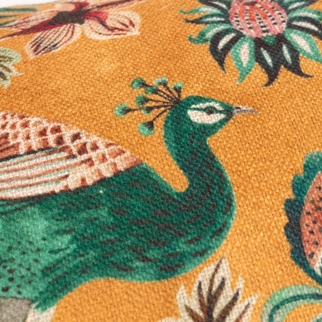 Inspired by organic shapes and symmetrical patterns, the Peacock Duo cushion adds a touch of charm to your soft furnishings. Printed on textured linen look fabric, two hand-painted peacocks pose in a mirror image of each other, amongst the intertwined vibrant florals. The deep-toned ochre background and luxurious claret velvet reverse contrast effectively to add vibrant tones to your home decor.