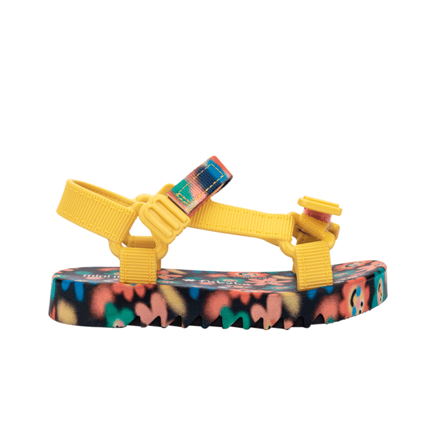 Experience unmatched fun and fashion with the Mini Melissa Playtime + Fabula - the sport sandal (papete) you never knew your mini desperately needed! The silhouette and has treaded soles and velcro straps with M logos. The insoles feature a unique, colorful print that is the perfect extra detail for a sunny day.