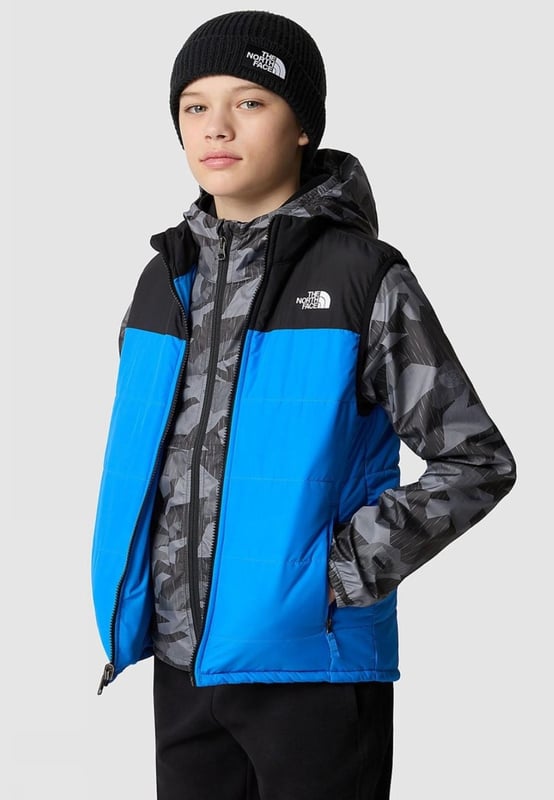 The Never Stop Insulated Gilet is the go-to choice for young explorers. Size XL - 14/16 Years,  Size 2XL- 18/20 Years. Packed with lightweight yet exceptionally warm synthetic insulation, it ensures warmth and comfort throughout every adventure. - -. The gilet's fabric is coated with a durable water-repellent finish, providing protection against light showers and keeping outdoor exploration enjoyable even in damp conditions. - -.  Versatile and practical, it is 3-in-1 compatible with yellow-label outer jackets from The North Face. - -. The gilet is equipped with two convenient zipped hand pockets and a reflective bar on the back hem, enhancing visibility and safety during outdoor activities. Stay warm, dry, and visible with The Never Stop Insulated Gilet on your side. - -. Body: 100% Recycled Polyester, Lining: 100% Recycled Polyester