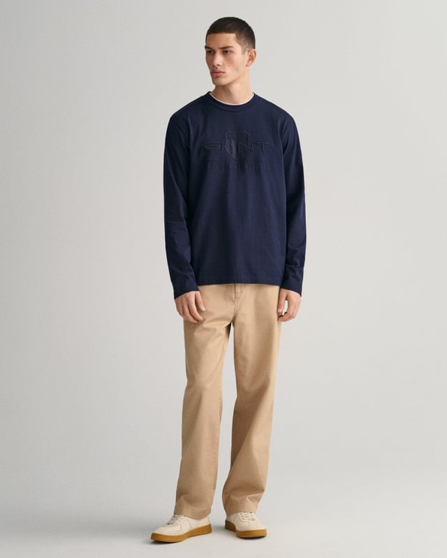 This cotton T-shirt from GANT is designed for a regular fit with long sleeves and a classic crew neck. It features a GANT shield graphic with a vintage-inspired touch embroidered at the chest in a shiny, tonal thread.

Regular fit
Crew neck
Long sleeves
Fine rib detailing at neck
GANT graphic embroidered at chest

100% cotton
2004041
 