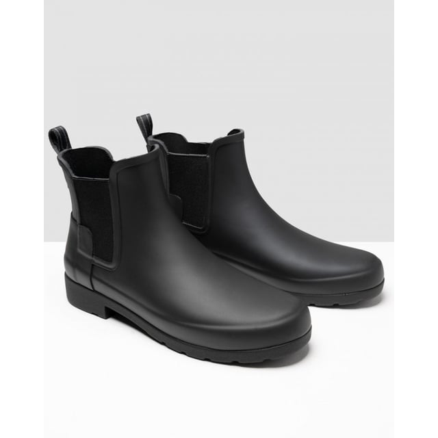 With a slimmer fit ideal for city-living, the Women's Refined Chelsea features a tailored shape and moulded footbed for everyday wear. A rework of the classic ankle boot, each boot is ready for rain and handcrafted from natural rubber which has been vulcanised for superior protection. Retaining the iconic features of the traditional Chelsea, elasticated gussets and a nylon pull tab make for easy wear. Perfect for everything from city commuting to last minute lunches, this waterproof boot in classic black is a wet weather essential.
We recommend that all Hunter Chelsea boots be worn with Hunter Chelsea socks, which have been technically designed to protect the wearer's skin from contact with rubber in specific areas.
&nbsp;

&nbsp;

Waterproof
Handcrafted
Polyester lining
Elastic side gussets and nylon pull-tab
Rubber outsole with Hunter Original tread pattern
Moulded foot bed for enhanced comfort and support
Crafted from natural vulcanised rubber with matte finish

&nbsp;