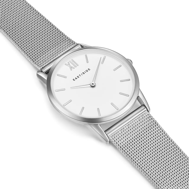 Subtle refraction is the trademark of the New York district of Eastside - as well as the Eastside watch label of the same name. This enchanting women's model reflects on traditional watch design away from opulence and glamor. Understatement is the order of the day! Tone kept in sound, combine the housing with high-quality screwed stainless steel floor and the elaborately worked stainless steel-milanaise bracelet cool elegance and hard-wearing materials. The dial is discreetly in the background and is reduced to the traditional function of a timepiece, with filigree barnacles and delicate swords.