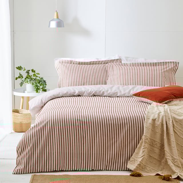 This duvet cover set is both a contemporary and classic addition to your home. The reversible subtle mélange print provides a luxurious woven striped appearance. The included matching pillowcases creates a simple yet relaxed look with their Oxford Borders; alongside the reversible stripe design that adds an effortless relaxed look to your bedroom. Choose your favourite side to fit with your style or flip sides to give your bedroom a midweek refresh. Single size includes one matching pillowcase measuring 50 x 75cm (20" x 30"), Double/King Size includes two matching pillowcases measuring 50 x 75cm (20" x 30").