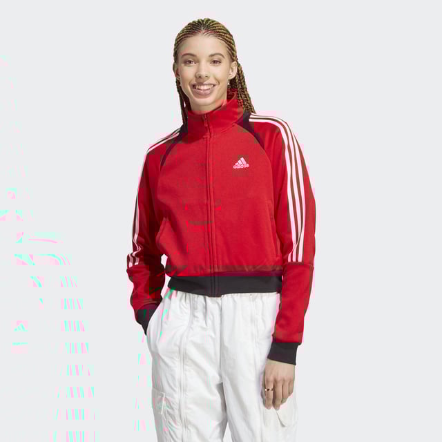 TIRO's versatile jacket is born from sport, but worn for style. Inspired by 90's football, this is the everyday comfortable essential you won't ever want to take off.  - This model is 173 cm and wears a size S. Their chest measures 81 cm and the waist 61 cm. - Loose fit - Full zip with stand-up collar - 70% recycled polyester, 30% cotton interlock - Front welt pockets - Ribbed cuffs and hem  Shipped by adidas