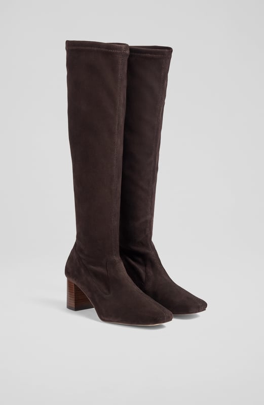 LK Bennett Davina Knee Boots, Chocolate Stretch boots are an LKB signature, and our Davina knee-high boots offer a sleek look and a comfortable fit in velvety-soft suede. Crafted in Spain from chocolate brown stretch suede, they have a square toe, a slim fit and a 60mm stacked block heel. Pull them on under winter skirts and dresses when it's time to up the winter layers.