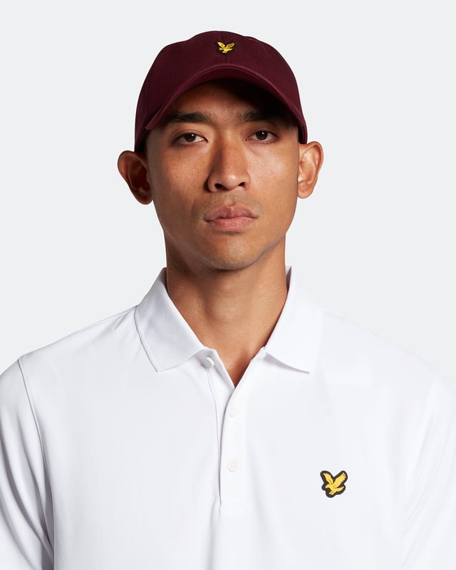 The Lyle &amp; Scott golf tech polo shirt. This regular-fit polo, is made from a recycled polyester blend and designed to be as lightweight as possible, with a three-button placket &amp; detail stitching on the collar and cuff.