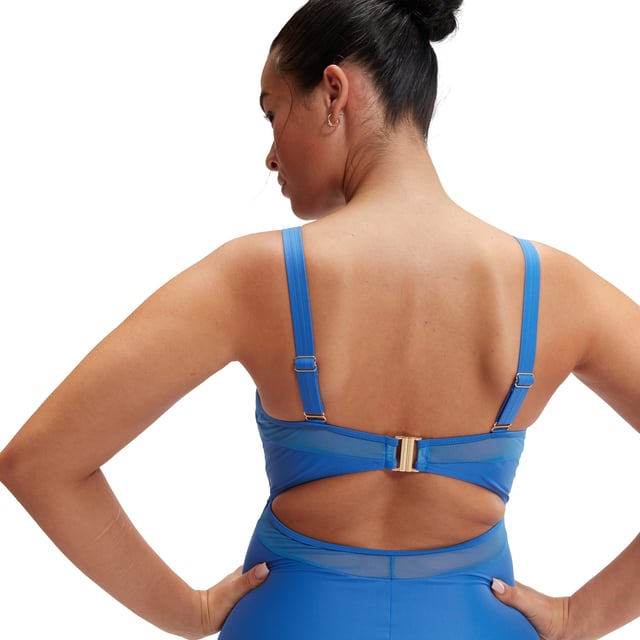 Womens Speedo Shaping Mesh Detail Swimsuit in blue.- V neck design with Mesh panel detail and clip back fastening.- Adjustable straps are paired with a clip back for an enhanced fit.- Bust support via seam construction and removable bra pads.- Embossed gold branding.- Premium body shaping fabric.- Higher chlorine resistance than standard swimwear fabrics - fits like new for longer with CREORA® HighClo™.- Our new shaping fabric is made in part from recycled waste. The Nylon yarn in the fabric is made from 100% pre-consumer waste  such as waste fabric from factories.- Ref: 800370016058Please note that returns will only be accepted if the hygiene label is still attached to the product.
