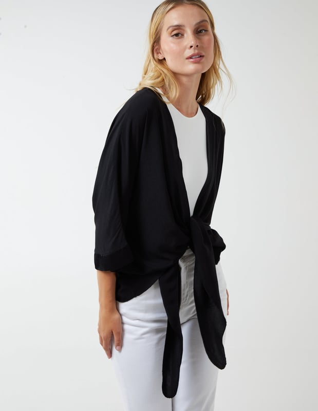 This top is a must have in your holiday suitcase. This stunning, simple top is perfect for a holiday cover up.