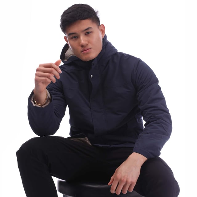 Mens Jack Jones Fen Parka Jacket in navy blazer.- Fixed hood.- Funnel neck.- Full zip fastening with storm placket.- Long sleeves.- Side entry flap pockets with snap closure.- Inner pocket at left chest.- Fully lined.- Main material: 100% Polyester.  Lining: 100% Recycled polyester.  Padding: 100% Recycled polyester fibres.  Machine washable.- Ref: 12268018