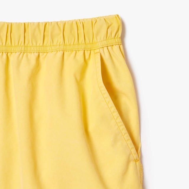 Mid Length Washed Effect Ombré Print Swim Trunks Recycled Polyester Taffeta Elasticated waistband with drawstring 2 pockets on sides  1 pocket on back Mesh lining Embroidered crocodile on front