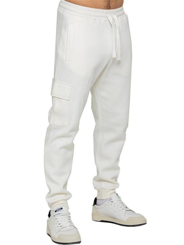 Experience superior comfort and style with Enzo Men's Regular Fit Cargo Joggers! Crafted with a brushed back inner fleece lining, these joggers are designed to keep you cozy all day long. Perfect for casual wear, they feature convenient 2 side slash pockets and 2 cargo pockets, providing ample storage space for your essentials. Stay on-trend with the cuffed leg design, offering a modern silhouette and added comfort.