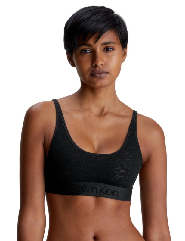Women who crave designer lingerie need to look no further than the Calvin Klein Intrinsic Unlined Bralette. With full cup coverage, this bralette is both comfortable and stylishly seductive. Crafted from feminine stretch lace material, it offers a snug fit while allowing for breathability. The wide elastic underband features the iconic Calvin Klein logo for added flair. The adjustable shoulder straps provide an option for a cross-back style and its hook and eye back closure makes changing a breeze. If you want a complete look, try pairing it with the matching briefs (available separately). The Calvin Klein Intrinsic Unlined Bralette is sure to take your lingerie wardrobe to the next level with superior comfort, quality and style.

Comfortable bralette style
Full cup design
Feminine stretch lace material
Wide elastic underband with iconic
Calvin Klein logo
Non-padded
Non-wired
Adjustable shoulder straps with cross-back style option
Hook and eye back closure
Matching briefs available
Country of origin: Sri Lanka
Composition: 83% Polyamide | 17% Elastane
Listed in UK sizes