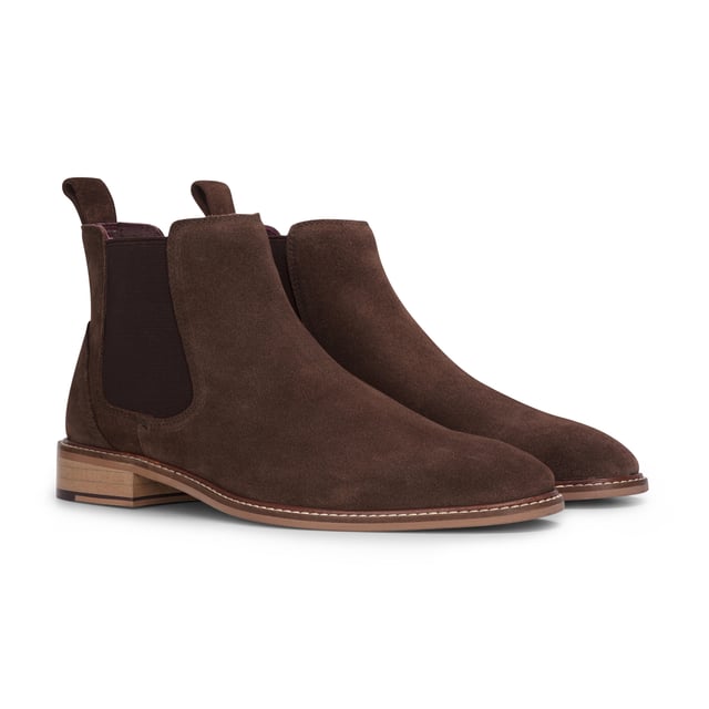 Elevate your footwear collection with the London Brogues Men's Brown Suede Leather Slip-On Chelsea Ankle Boots. Crafted from premium suede leather, these boots offer a luxurious look and feel, perfect for enhancing both casual and formal outfits. The convenient slip-on design features elastic side panels for a snug fit and easy wear. With a durable leather sole providing superior grip, these boots are suitable for various surfaces and weather conditions. Enjoy all-day comfort with the cushioned insole, making them ideal for long hours on your feet.

Premium Suede Leather for a sophisticated appearance
Slip-On Convenience with elastic side panels
Durable Sole with Superior Grip for traction
Cushioned Insole for Comfort ideal for extended wear