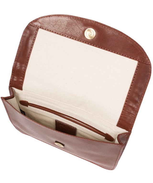 The 'Cara' cross body clutch bag from Conkca London is handcrafted from multi-toned leather for a beautiful finish. A magnetic press-stud secured cover opens to reveal the spacious interior that is lined with natural and untreated 100% cotton and includes two slip pockets. A full-width slip pouch on the rear of the bag is ideal for on-the-go storage. It comes with an adjustable leather strap with a maximum drop length of 70cm which is removable, converting the bag into a clutch bag. Adorned with the inimitable Conkca squirrel charm and metal logo.