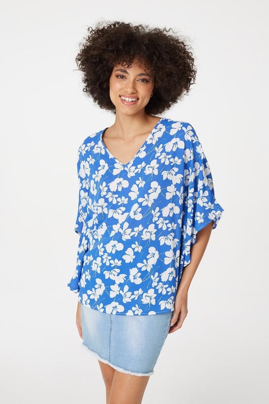 Every warm weather wardrobe needs a versatile floral print like this relaxed fit blouse. It has a V-neck, 1/2 length flared batwing sleeves, a relaxed fit and a hip length hem. Pair with your favourite sandals or flats for a stylish off-duty look.