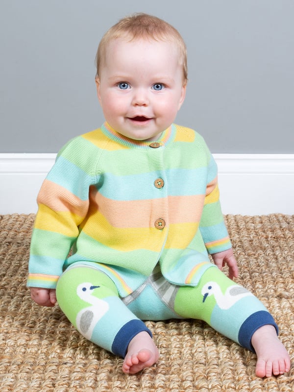When cooler weather comes calling your little one will love to be snuggled up in this sunset stripe cardi. In a lovely soft lightweight knit, the delightful rainbow style cardigan is a great choice for completing any outfit this season.