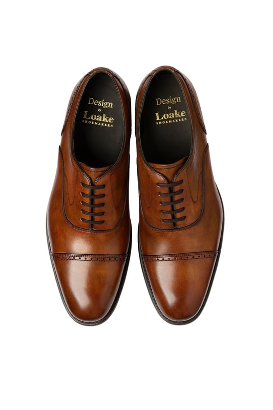 Loake Hughes Hand Painted Shoe Chestnut
A premium semi-brogue with a generous fit and bold toe shape. The light brogue detailing and straight toe cap gives Hughes and uncomplicated design, boasting effortless class and style to be worn easily with suiting or chinos.

100% Premium Leather
Rubber & Leather Goodyear welted sole
Semi Brogue
Unique Finish from Hand Painted Technique
Style - HUGHES
