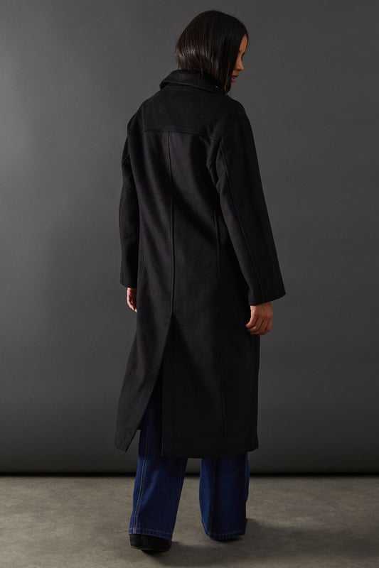 Double-breasted design for a sophisticated silhouette
        Maxi length offering full coverage and dramatic flair
        Wide lapels adding a touch of classic elegance
        Flap pockets for both style and functionality
        Relaxed fit allowing for layering versatility
    
    Make a statement with this striking double-breasted maxi coat from Warehouse. Perfect for the confident woman who appreciates edgy yet feminine style, this coat seamlessly transitions from day to night. The oversized silhouette exudes effortless chic, while the maxi length adds drama to any ensemble. Style it over wide-leg trousers and a chunky knit jumper for a contemporary daytime look. For evening affairs, drape it over a sleek midi dress and pair with heeled boots to create a captivating outfit. The versatile design allows for endless styling possibilities, making it a true wardrobe staple that will serve you well for seasons to come. Whether you're heading to the office or out for dinner, this coat will ensure you arrive in style.