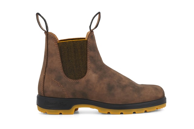 A refresh of the bestselling Blundstone 585 Chelsea boots, the Blundstone 1944s take everything that is great about the original Australian Blundstone boots, and turns it up to max, sacrificing nothing in terms of comfort and function while continuing to look and feel fantastic. With rustic brown water-resistant leather uppers and an eye-catching contrasting TPU sole and mustard accents, the Blundstone 1944s offer a fresh view on classic Blundstone design. A modern take on a timeless classic, these boots are just as much at home in sophisticated urban cityscapes as they are deep in the Australian outback. Comfort is taken to the next level with the removable footbeds and XRD® Technology in the heel for shock absorption, and results in a pair of boots that will come out unscathed from anything you can throw at it.All the durability. More comfort. More shock absorption. More places to see in your Blundstone 1944 boots.  Built for adventures with water resistant, 2.5mm thick premium rustic brown leather uppers Brown herringbone elasticated sides and iconic pull tags for easy slip-on Leather lined for comfort Highly durable TPU outsole ensures that the boot can take a beating Cushioned midsole for all-day comfort Blundstone SPS Max Comfort system for superb shock absorption of up to 90% Extra set of footbeds so you can find your best fit Lightweight for all-day comfort, everyday