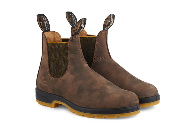 A refresh of the bestselling Blundstone 585 Chelsea boots, the Blundstone 1944s take everything that is great about the original Australian Blundstone boots, and turns it up to max, sacrificing nothing in terms of comfort and function while continuing to look and feel fantastic. With rustic brown water-resistant leather uppers and an eye-catching contrasting TPU sole and mustard accents, the Blundstone 1944s offer a fresh view on classic Blundstone design. A modern take on a timeless classic, these boots are just as much at home in sophisticated urban cityscapes as they are deep in the Australian outback. Comfort is taken to the next level with the removable footbeds and XRD® Technology in the heel for shock absorption, and results in a pair of boots that will come out unscathed from anything you can throw at it.All the durability. More comfort. More shock absorption. More places to see in your Blundstone 1944 boots.  Built for adventures with water resistant, 2.5mm thick premium rustic brown leather uppers Brown herringbone elasticated sides and iconic pull tags for easy slip-on Leather lined for comfort Highly durable TPU outsole ensures that the boot can take a beating Cushioned midsole for all-day comfort Blundstone SPS Max Comfort system for superb shock absorption of up to 90% Extra set of footbeds so you can find your best fit Lightweight for all-day comfort, everyday