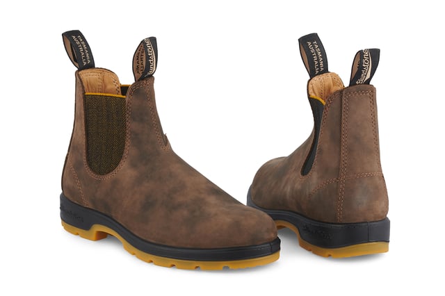 A refresh of the bestselling Blundstone 585 Chelsea boots, the Blundstone 1944s take everything that is great about the original Australian Blundstone boots, and turns it up to max, sacrificing nothing in terms of comfort and function while continuing to look and feel fantastic. With rustic brown water-resistant leather uppers and an eye-catching contrasting TPU sole and mustard accents, the Blundstone 1944s offer a fresh view on classic Blundstone design. A modern take on a timeless classic, these boots are just as much at home in sophisticated urban cityscapes as they are deep in the Australian outback. Comfort is taken to the next level with the removable footbeds and XRD® Technology in the heel for shock absorption, and results in a pair of boots that will come out unscathed from anything you can throw at it.All the durability. More comfort. More shock absorption. More places to see in your Blundstone 1944 boots.  Built for adventures with water resistant, 2.5mm thick premium rustic brown leather uppers Brown herringbone elasticated sides and iconic pull tags for easy slip-on Leather lined for comfort Highly durable TPU outsole ensures that the boot can take a beating Cushioned midsole for all-day comfort Blundstone SPS Max Comfort system for superb shock absorption of up to 90% Extra set of footbeds so you can find your best fit Lightweight for all-day comfort, everyday