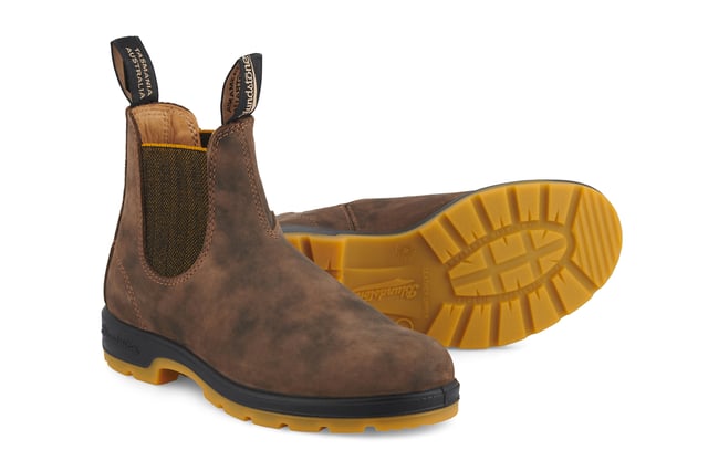 A refresh of the bestselling Blundstone 585 Chelsea boots, the Blundstone 1944s take everything that is great about the original Australian Blundstone boots, and turns it up to max, sacrificing nothing in terms of comfort and function while continuing to look and feel fantastic. With rustic brown water-resistant leather uppers and an eye-catching contrasting TPU sole and mustard accents, the Blundstone 1944s offer a fresh view on classic Blundstone design. A modern take on a timeless classic, these boots are just as much at home in sophisticated urban cityscapes as they are deep in the Australian outback. Comfort is taken to the next level with the removable footbeds and XRD® Technology in the heel for shock absorption, and results in a pair of boots that will come out unscathed from anything you can throw at it.All the durability. More comfort. More shock absorption. More places to see in your Blundstone 1944 boots.  Built for adventures with water resistant, 2.5mm thick premium rustic brown leather uppers Brown herringbone elasticated sides and iconic pull tags for easy slip-on Leather lined for comfort Highly durable TPU outsole ensures that the boot can take a beating Cushioned midsole for all-day comfort Blundstone SPS Max Comfort system for superb shock absorption of up to 90% Extra set of footbeds so you can find your best fit Lightweight for all-day comfort, everyday