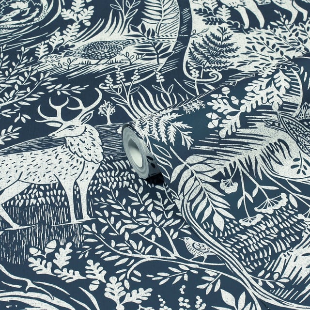 Invite nature into your home with the Winter Wood wallpaper featuring a stunning woodblock inspired print with plenty of woodland animals and trees. The elegant and graceful highland stag is complimented by hares, foxes, and owls in gorgeous rich blue palette, this design will add a focal point to your décor. This wallpaper is a paste the wall application; simply paste the wall, hang your paper, and leave to dry. Each roll is 10m long and 52cm wide. Pattern repeat: 53cm Straight Match. Our Winter Wood wallpaper can be used to paper the whole room or to create an eye-catching feature wall. This wallpaper is also wipeable so that any light marks can be dabbed away.