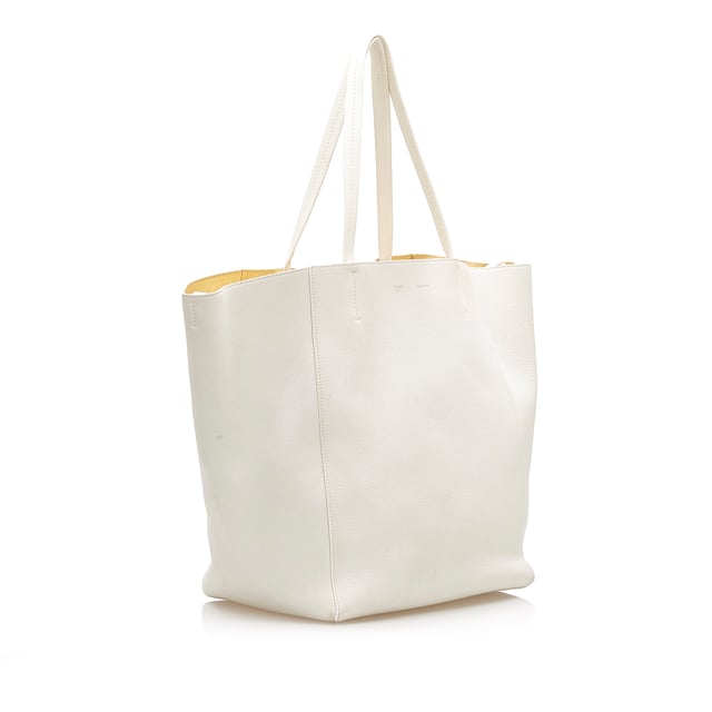 VINTAGE. RRP AS NEW. The Cabas Tote features a leather body, flat leather straps, an open top, and an interior zip pocket.Exterior back is discolored and stained. Exterior bottom is discolored and stained. Exterior corners is discolored and stained. Exterior front is discolored and stained. Exterior handle is discolored. Exterior side is discolored and stained. Interior lining is discolored and stained. Interior pocket is discolored and stained.

Dimensions:
Length 33cm
Width 50cm
Depth 17cm
Shoulder Drop 22cm

Original Accessories: Pouch

Color: White
Material: Leather x Calf
Country of Origin: France
Boutique Reference: SSU94347K1342


Product Rating: GoodCondition