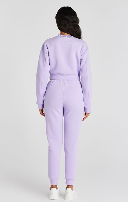 inchLilac Crop SweatshirtCropped fitSoft touchEmbroidered patchCrew neckPrinted neckbandMachine wash67% Cotton 33% Polyester inch