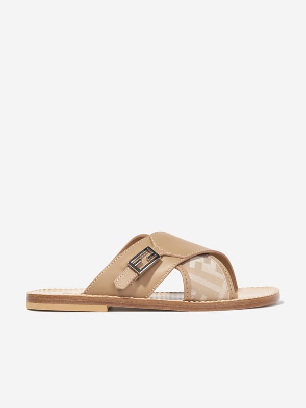 Introducing the high-end symbol of elegance, the Girls Leather FF Logo Sandals in Beige by Fendi. This Italian-made designer footwear is perfect for your little fashionista's Summer look. Here are the standout features: Italian Craftsmanship: Immaculately designed in Italy for a durable and long-lasting wear. Signature FF Logo: The trendy FF Logo by Fendi adorns the sandals adding a distinguished style statement. Supreme Comfort: Created with high-grade leather ensuring a comfortable stride on all summer adventures. Upgrade Your Wardrobe: Enlighten your girl's collection with the chic FF Logo Sandals in Beige. Shop now for distinct elegance and timeless style!