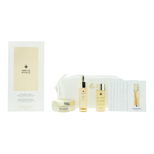 Guerlain Abeille Royale Gift Set is an anti-aging collection features advanced Dynamic BlackBee Repair Technology to nourish, firm, and rejuvenate the skin. It includes a Day Cream, Lotion, Oil, and Serum, all designed to combat signs of aging and enhance radiance. Complete with an elegant pouch, it's the perfect luxurious skincare treat.