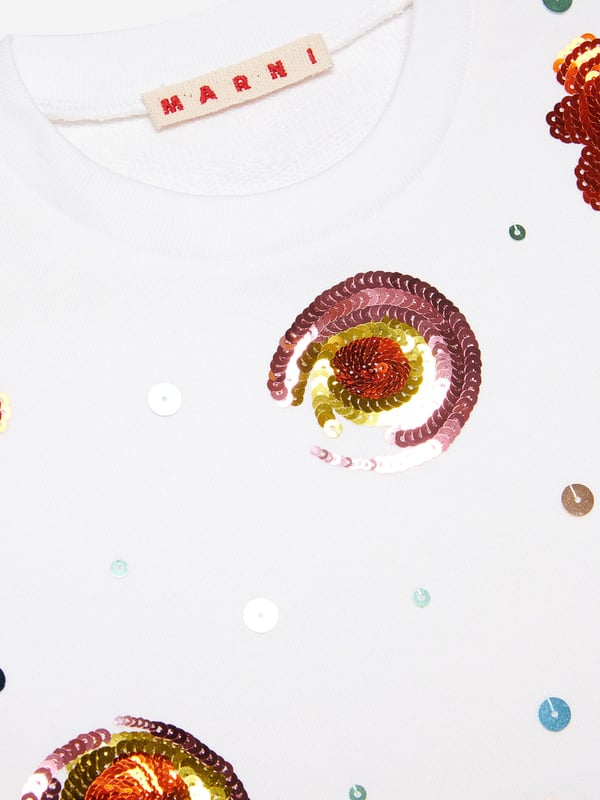 Marni embody innovation and high quality detailing in their sleek, everyday pieces. This girls sweatshirt is a captivating summer piece to invest in. Envisioned in a beautiful colour block crew-neck sweatshirt with Sunny Day print embellished sequins. It is accentuated by a colour contrasting embroidered logo. Long-Sleeved Ribbed Crew-Neck, Cuffs and Bottom 100% Cotton