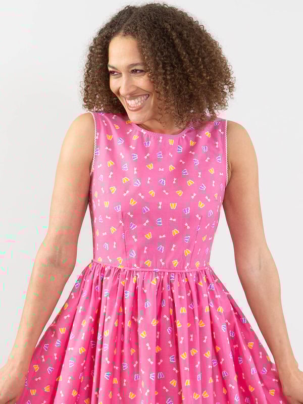 Dance in the sun in this flattering Chesil dress. Featuring Kite's lovely water lily print on lightweight poplin fabric, wearing this dress is sure to fill you with good times vibes! The softly gathered skirt, with a gorgeous, shaped bodice, gives a lovely fit and feel. Combined with delicate picot lace edging around the arm holes and a concealed back zip opening, this dress is definitely a seasonal stunner.
