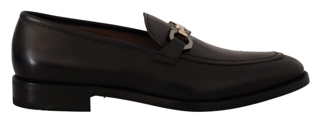 Brand new with tags and dust bag
  100% authentic Salvatore Ferragamo mens shoes
  Model: Lewis
  Color: Black
  Material: 100% Calf Leather
  Formal version of the gentlemens loafer
  Calf leather tumbled and hand buffed for depth of color
  Gancio bit in cool palladium finish
  Open grooves reveal stitching on leather sole
  Made according to Originali construction method
  Made in Italy
Material: Calf Leather