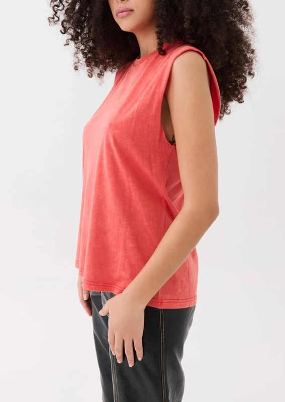 Relaxed fit, lightweight feel tank. Raw cut armholes. P.E Nation graphic on the front