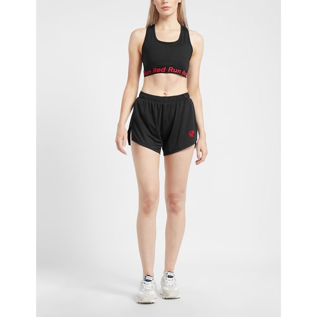 Created by women for women  Red Run are passionate about creating activewear that fits your body and lifestyle. Making sure you feel and look good whatever your day entails  Red Run use only the best in luxurious and breathable materials  ensuring you feel comfortable and confident with every step. They present to you the Inky Collection which includes the Running Shorts in black  the perfect activewear essential. Details: black colourway  polyester construction  attached interior shorts  elasticated waistband  split hem  short length  regular fit  tonal stitching and contrast branding to the leg to complete. This item is true to Red Run Brand sizing XS (UK 8) up to XL (UK 16).