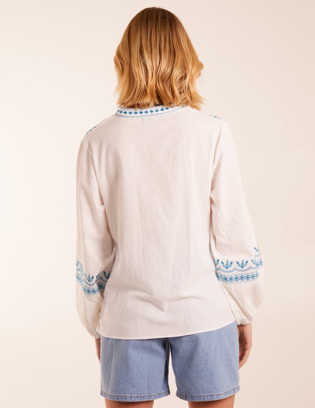 This delicate embroidery puff sleeve blouse brings a touch of elegance to your everyday wardrobe - we love wearing it with light denim. 
100% Cotton