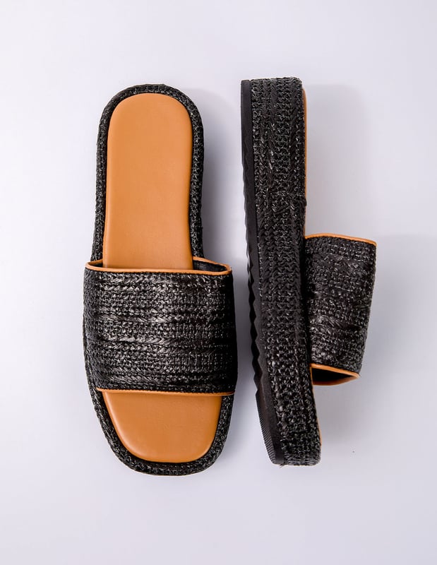 Espadrille soles and woven details make these black sandals a stylish pick on sunny-weather days. Comfort is key, and these sliders provide everything you need in a summer time slider!