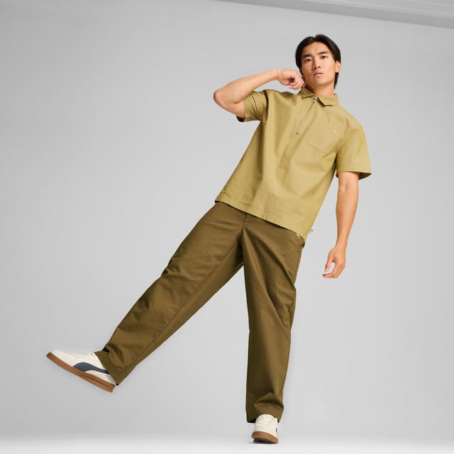 PRODUCT STORY: MMQ = "Macht's mit Qualität." Translated from German, it means "Made with Quality" and represents the finest in PUMA's designs and materials. Minimalistic aesthetics, contemporary silhouettes, with a passion for sophisticated details. This shirt has a relaxed fit and a half-zip closure. FEATURES & BENEFITS: Made with at least 20% recycled cotton. DETAILS: Relaxed fit; 210 gsm, plain weave; Collar; Short sleeves; Half-zip closure with metal zip pull; Chest pocket.