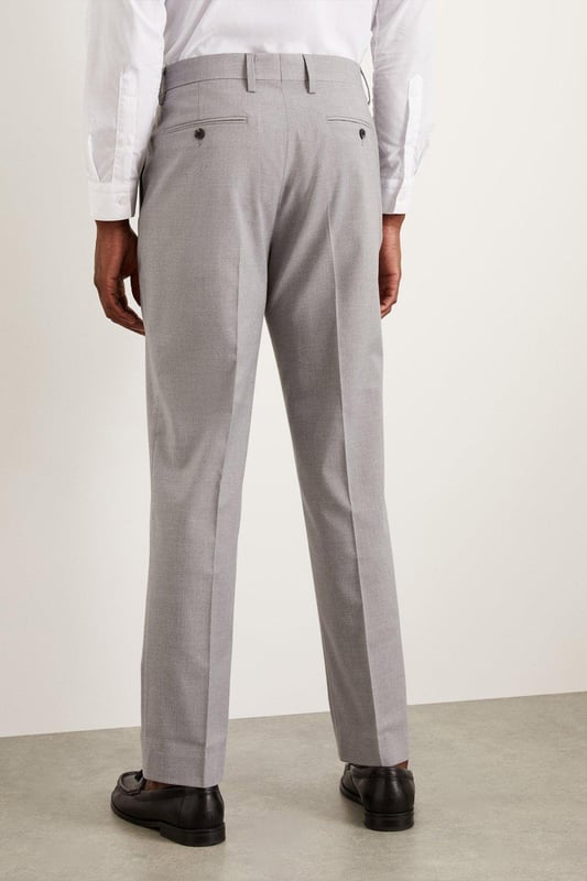 Introducing our Essential Tailored Fit Smart trousers, a must-have addition to your wardrobe. These trousers features a zip fly fastening for convenience and is designed to provide a sleek and polished look. Made with a polyester viscose blend with added stretch ensures a cool and comfortable fit all day long. Pair these versatile trousers with matching items, perfect for any smart occasion.