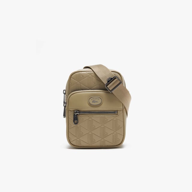 Monogram Print Small Crossover Bag.- Dimensions: L5.1 x L7.2 x D2.7 in.- L13 x H18.5 x D7 cm.- Exterior in Split Calfskin Leather.- Adjustable strap: 75cm - 140cm - 29.5 - 55 in.- 2 zipped outside pockets, 1 mesh inside pocket.- Enamel plaque with crocodile logo. Material: 100% Split Calfskin Leather. Ref: NH4399MRC87.