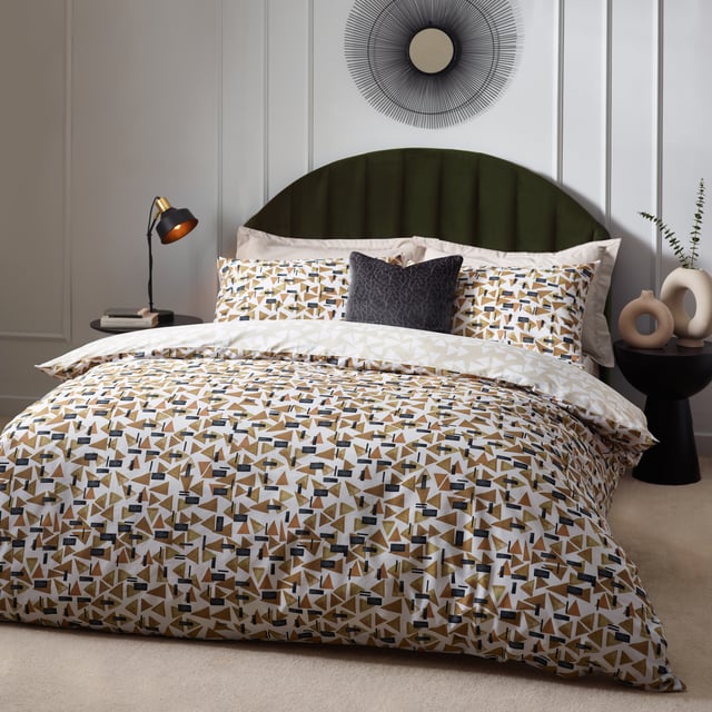 Inspired by modern, minimalist and abstract art, the City duvet cover set contains a fusion of small geometric shapes in warming tones, which combine to create this polished design. The reverse offers a muted, natural alternative for a more relaxing look. A sophisticated step into modern design for the contemporary home. This product is certified by OEKO-TEX® showing it has been sustainably made.